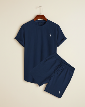 Navy lounge set by San Valier with subtle ribbed texture, including a T-shirt on a hanger and matching shorts.