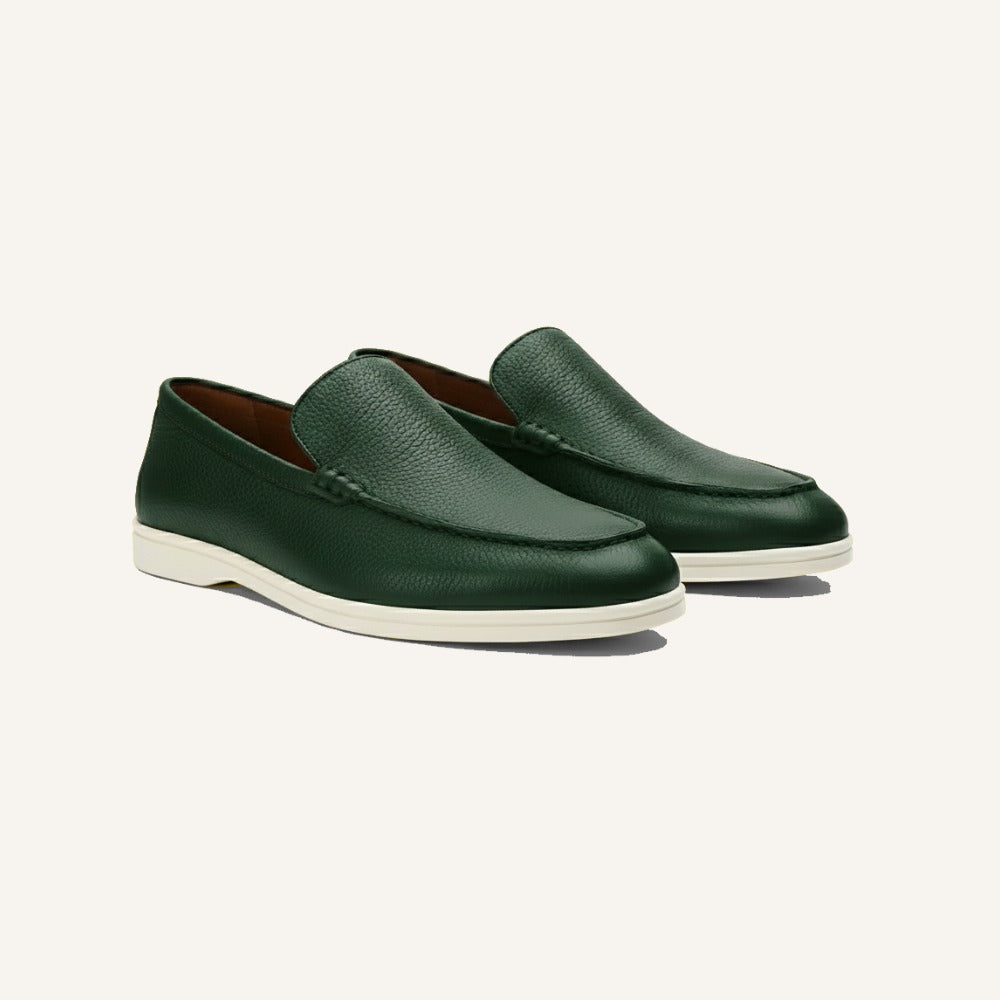 Green cow leather loafer by San Valier with a pebble grain texture and white soles.