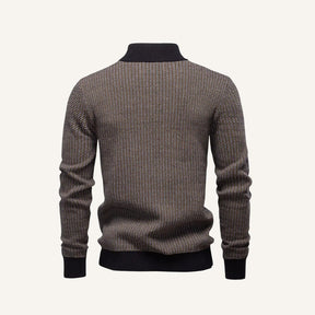 Brown knit quarter-zip sweater by SanValier, featuring an all-over geometric pattern and a black ribbed collar, cuffs, and hem.