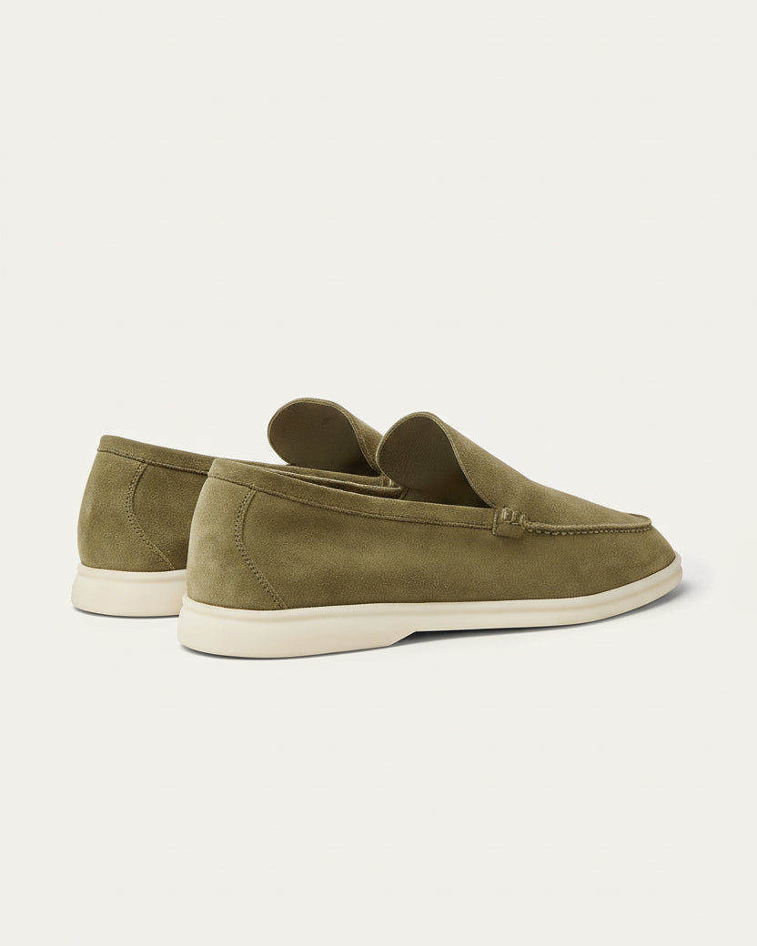 Olive green suede loafers by SanValier, with a moccasin-stitched toe and a light-colored sole.