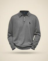 Gray long-sleeve polo shirt by Ralph Lauren, featuring a spread collar and three-button placket.